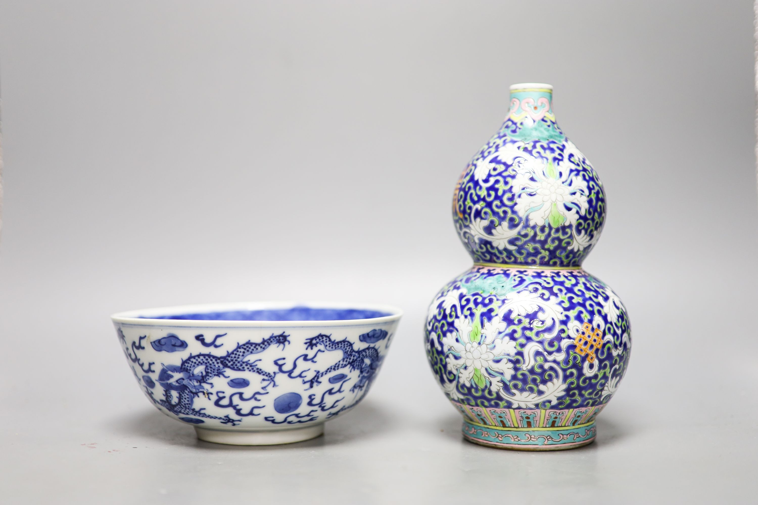 A 19th-century Chinese blue and white dragon bowl and a Chinese enamelled porcelain double gourd vase 22 cm high